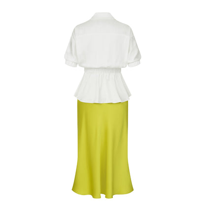Back view of a white silky peplum blouse paired with a lime green satin midi skirt, showing the elastic waist and flared hem