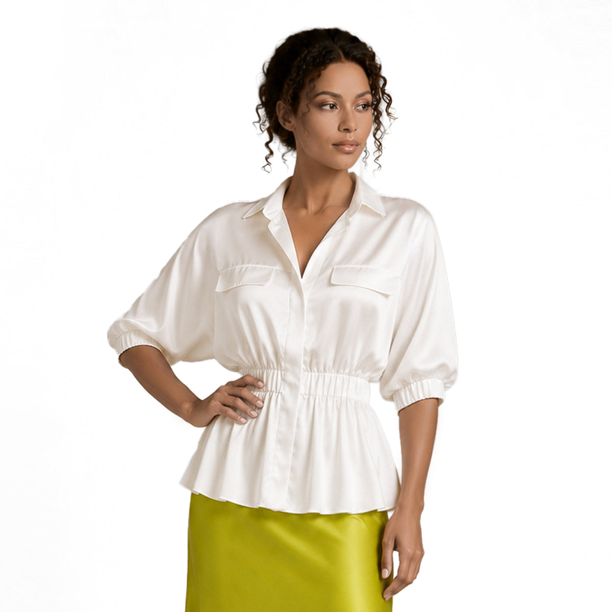 Model wearing a white silky viscose peplum blouse with puff sleeves, elastic waist, concealed buttons and collared neckline